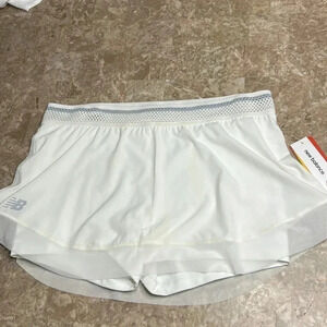 New Balance white skort with lace hem  , pin holes in skirt and cut out in band